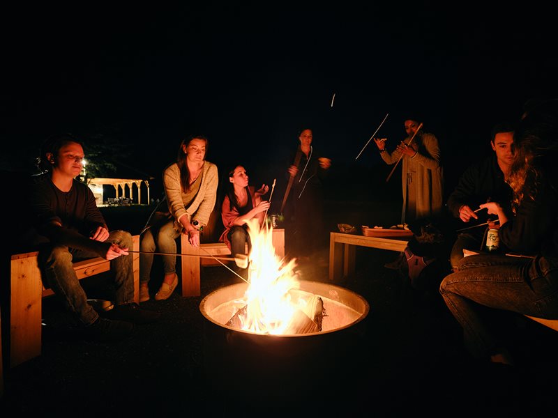 People sitting around fire